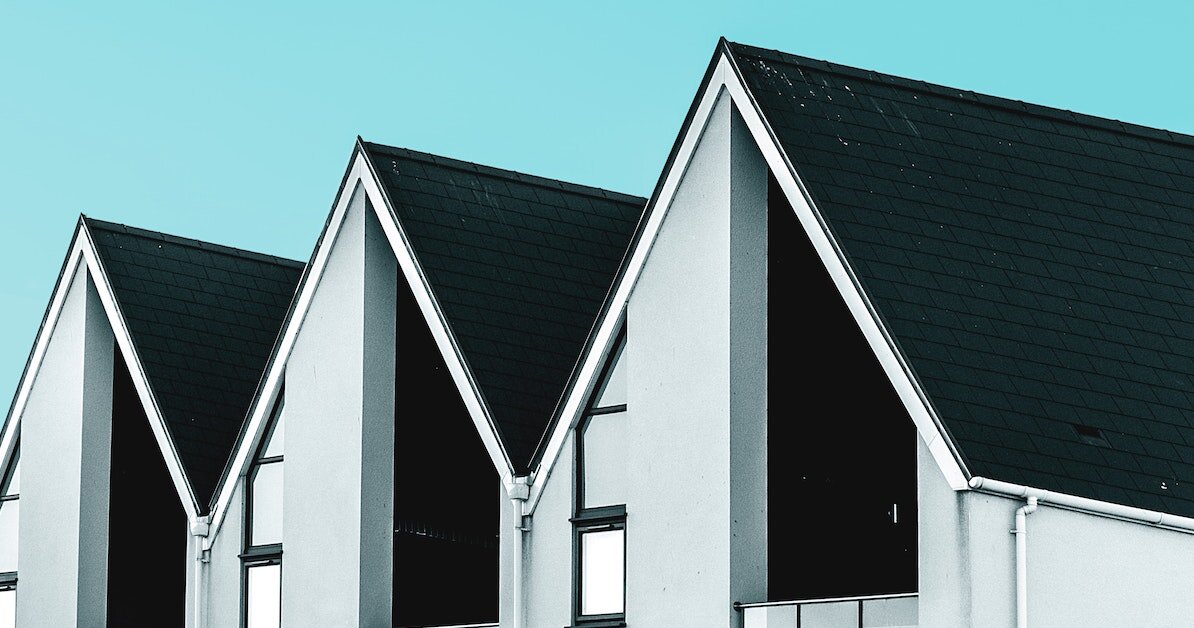 Three gabled rooflines against a teal sky Three gabled rooflines against a teal sky